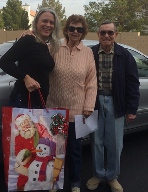 Mercedes and Ty Hilbrecht donating socks collected from the Mercedes Benz Club of America Las Vegas Chapter.